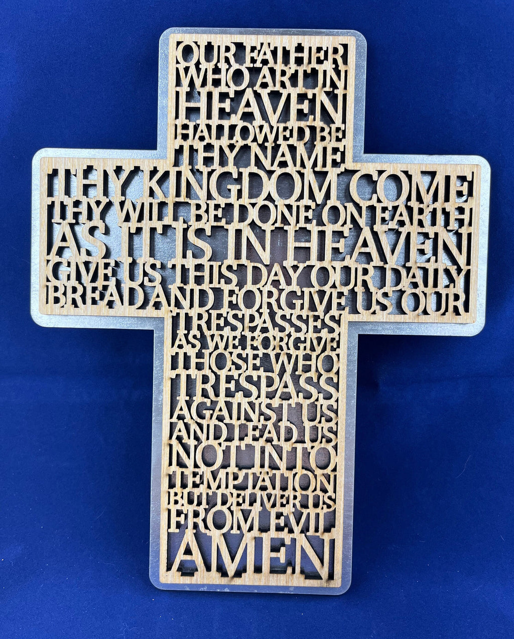 Lord prayer laser cut into the sign of cross