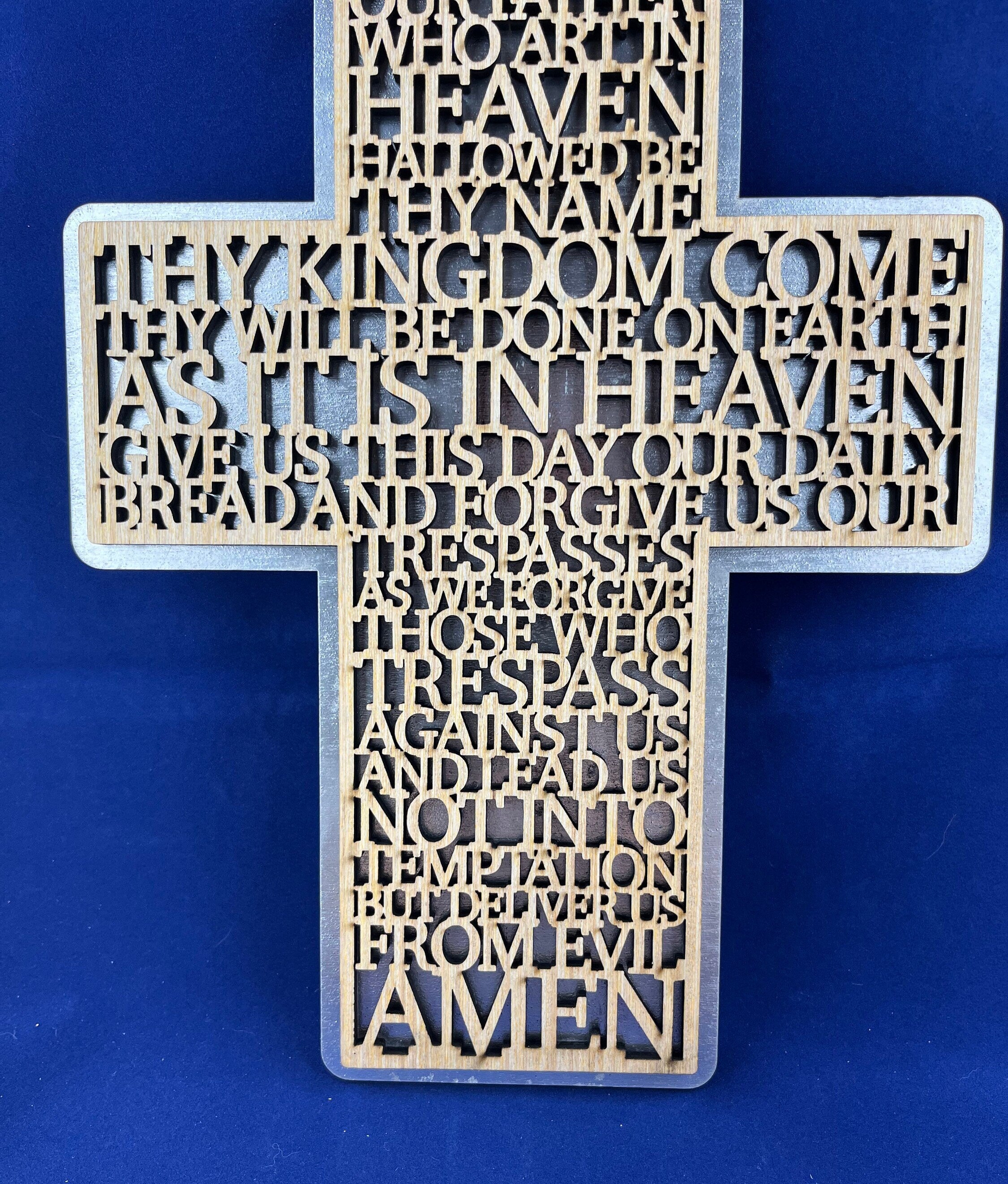 Lord prayer laser cut into the sign of cross