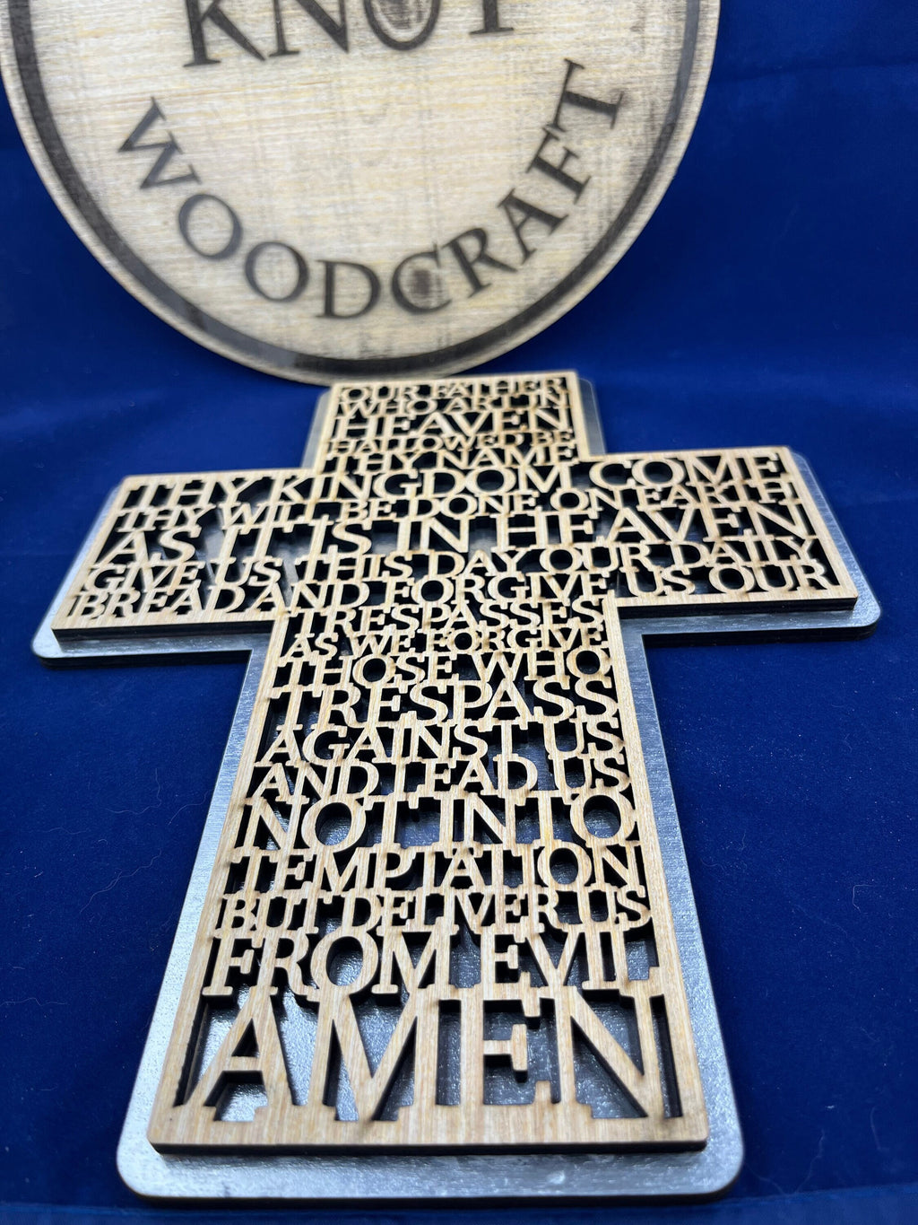 Lord prayer laser cut into the sign of cross